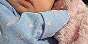 Taileah joined the competition — help win amazing prizes! baby, infant, face, blanket, blue_clothing, pink_hearts, cozy, closeup, sleepy, soft_texture, newborn, cute, wrapped, child, indoor, warm, portrait, skin, expression, comfort