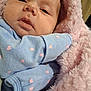 baby, infant, face, blanket, blue_clothing, pink_hearts, cozy, closeup, sleepy, soft_texture, newborn, cute, wrapped, child, indoor, warm, portrait, skin, expression, comfort