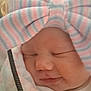 newborn, baby, sleeping, closeup, hat, striped_hat, bow, blanket, soft, peaceful, face, infant, cute, child, wrapped, warm, cozy, portrait, indoors, young