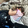 child, cat, bed, blanket, sleeping, indoor, cozy, tabby_cat, person, pajamas, furniture, relaxing, cute, hair, comfort, nap, together, rest, soft, sleep