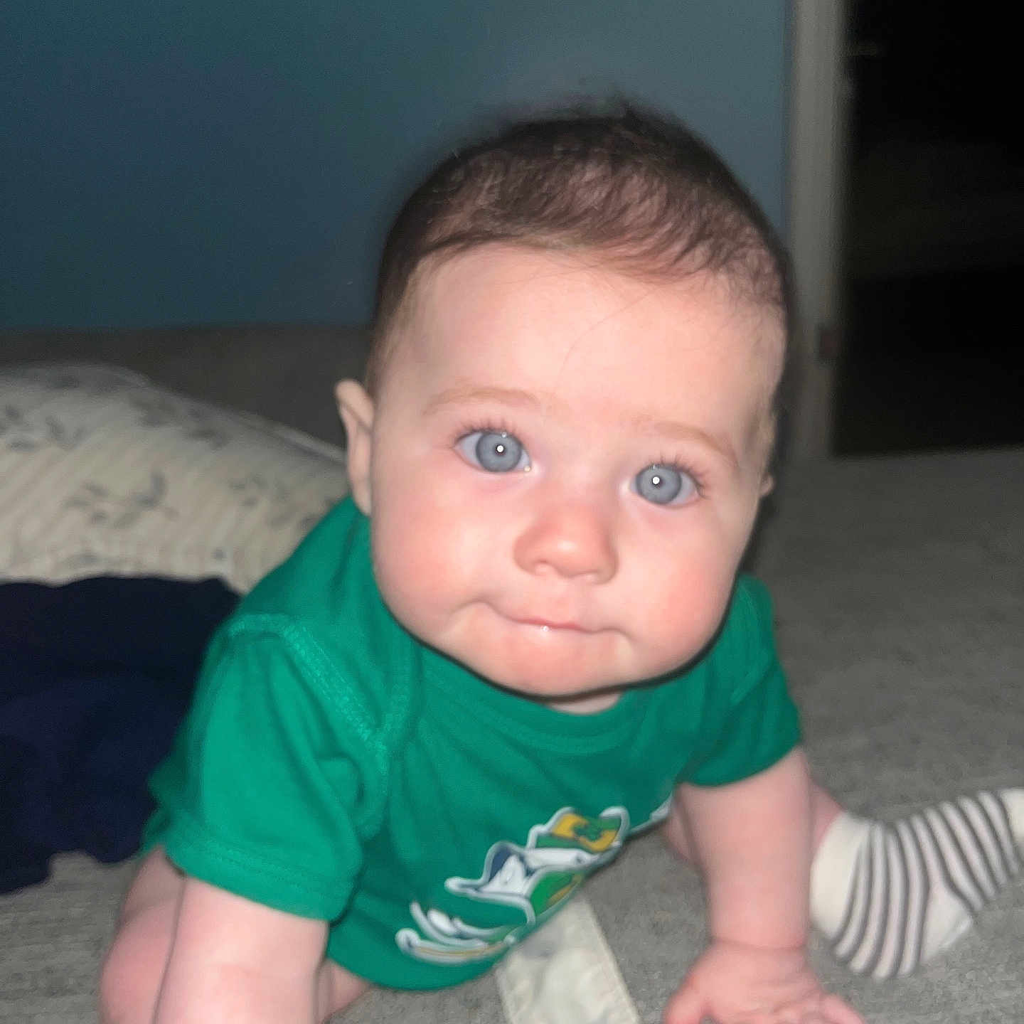 Skylar is registered to the contest to win money with this photo: baby, babycrawling, bed, bedroom, bodypart, clothing, crawling, face, finger, furniture, head, hosiery, indoors, pants, person, photography, portrait, room, sock, t_shirt