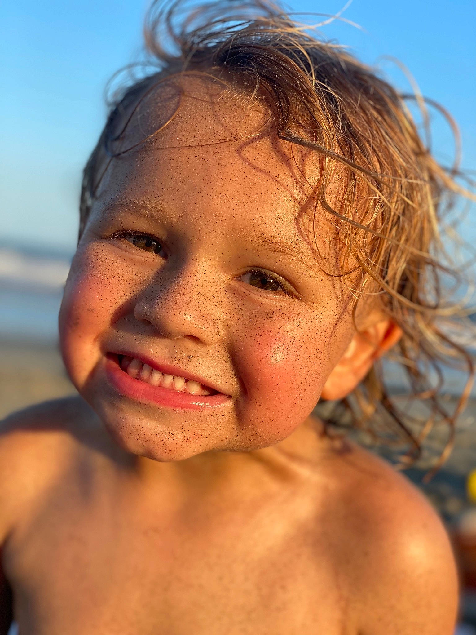 Camdyn is registered to the contest to win money with this photo: body_of_water, cheek, chin, eye, eyebrow, eyelash, forehead, hair, happy, iris, jaw, joy, lip, mouth, muscle, neck, nose, people_on_beach, person, skin