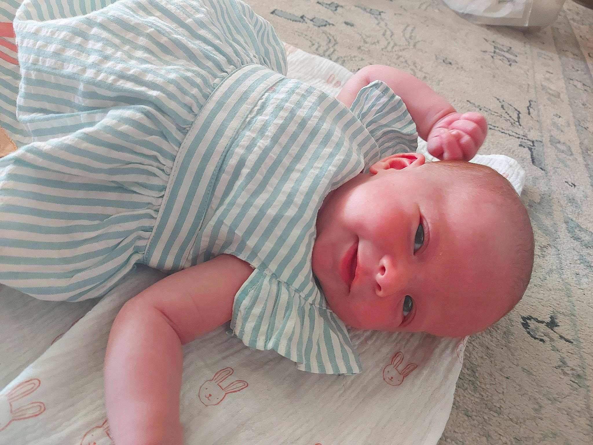 Amélie joined the competition — help win amazing prizes! baby, baby_toddler_clothing, cheek, child, chin, comfort, eye, face, facial_expression, flooring, grass, head, linens, mouth, nose, person, skin, sleeve, textile, toddler