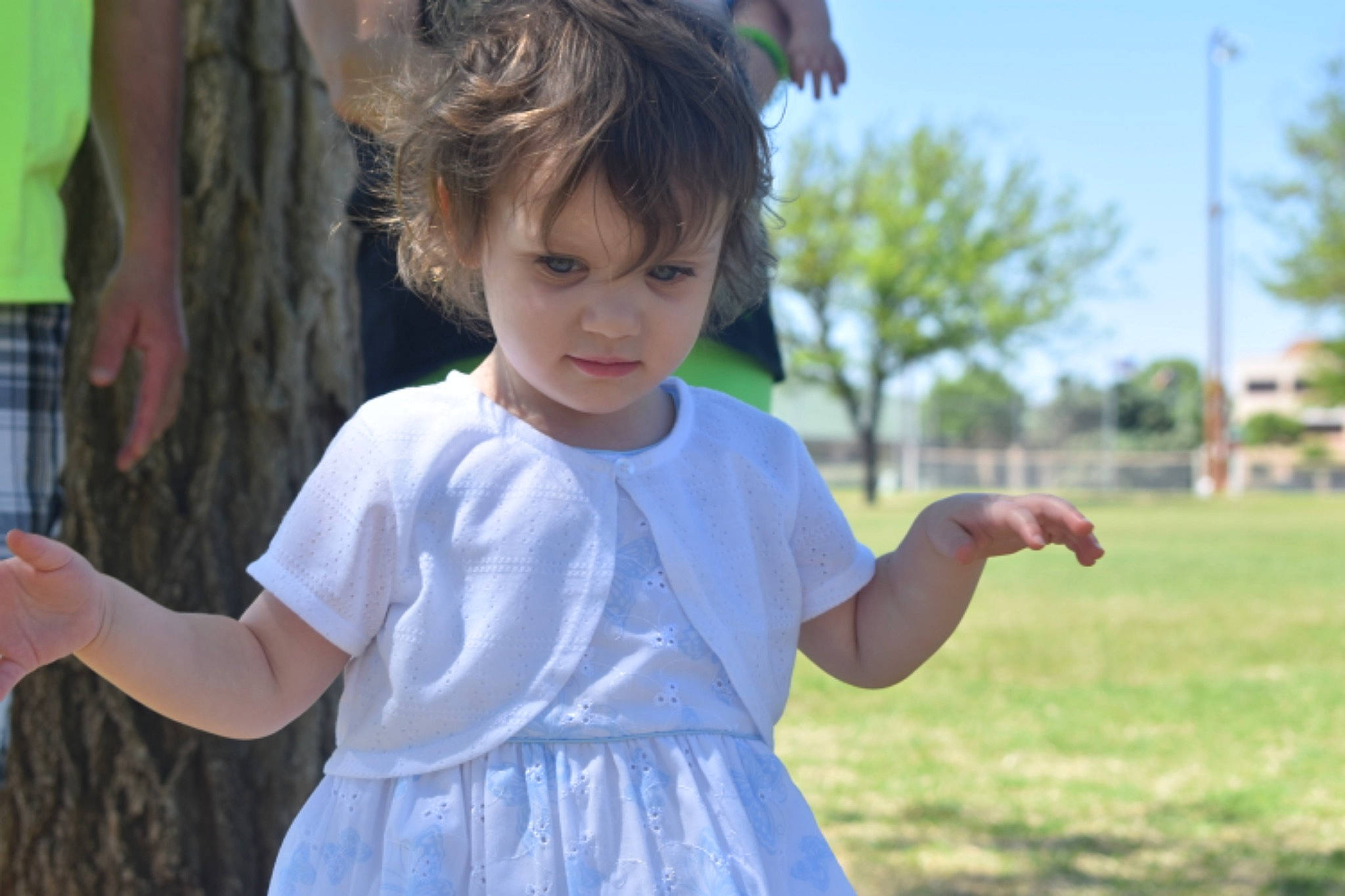 Lily is registered to the contest to win money with this photo: arm, child, ear, finger, fun, gesture, grass, hand, happy, person, photography, play, smile, summer, thumb, toddler, tree, vacation