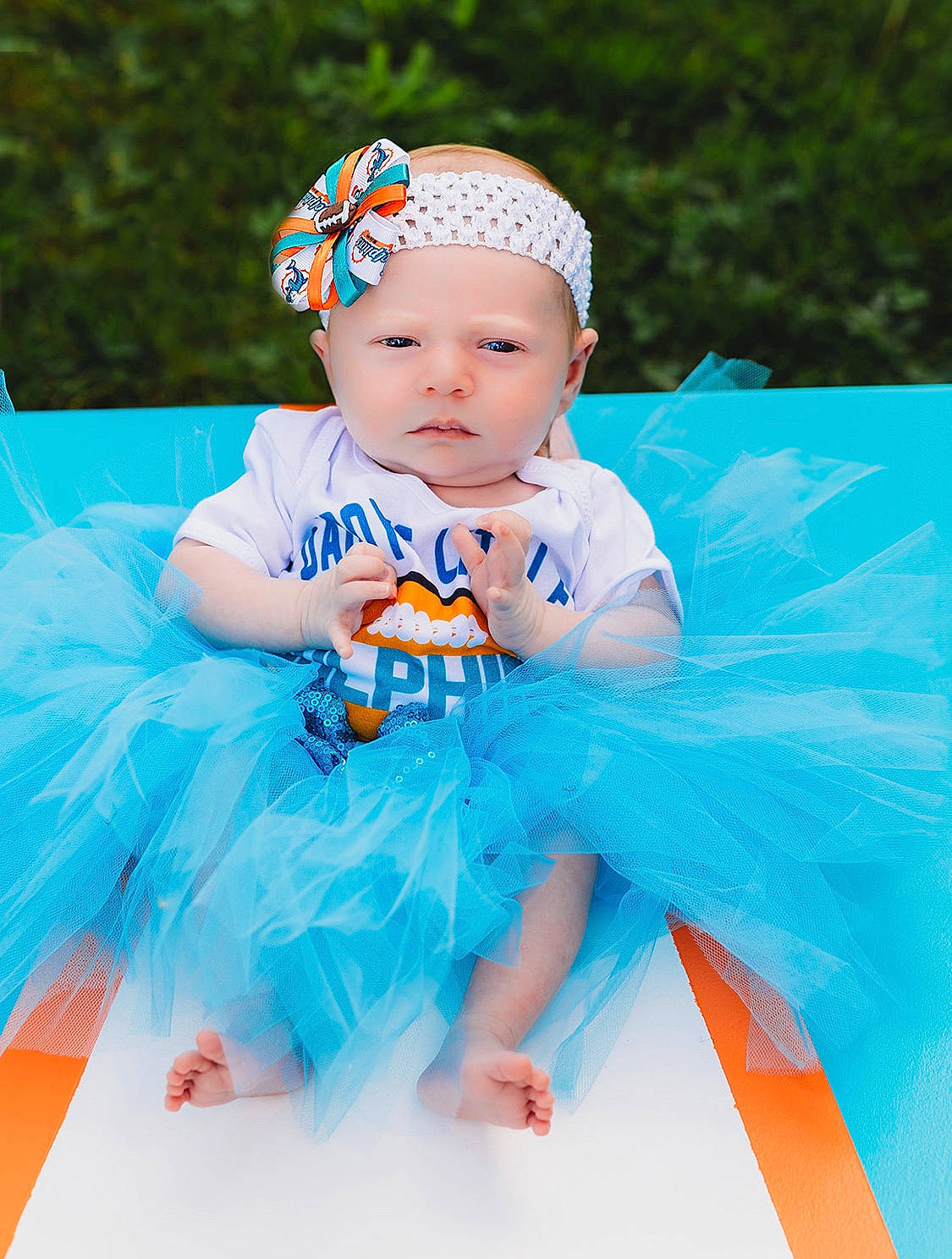 Bayleigh is registered to the contest to win money with this photo: aqua, baby, baby_products, baby_toddler_clothing, blue, child, clothing, costume, costume_accessory, fun, hair_accessory, headband, headgear, headpiece, headwear, leisure, orange, person, product, skin