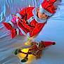 baby, candy_cane, child, christmas, cozy, cute, fairy_lights, festive, gift_bag, holiday, indoors, plaid_pants, red_hat, red_shoes, santa_claus_costume, sleeping, soft_lighting, teddy_bear, toy, white_bed