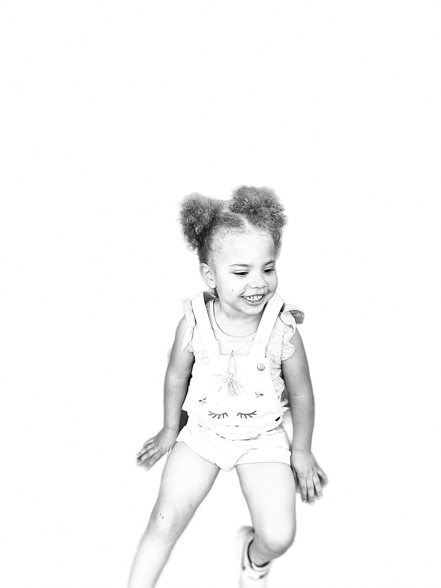 Paityn is registered to the contest to win money with this photo: abdomen, baby_toddler_clothing, barefoot, child, elbow, event, fashion_design, flash_photography, gesture, happy, human_leg, joy, monochrome, monochrome_photography, person, sitting, sleeve, smile, t_shirt, thigh