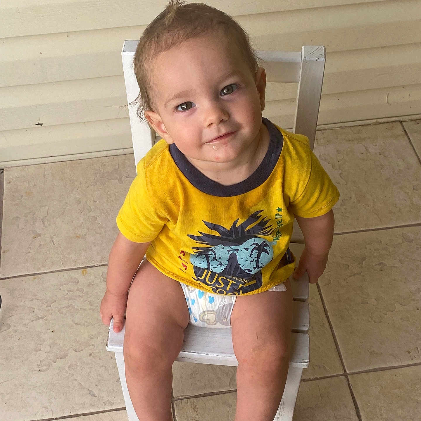 Owen Keith is registered to the contest to win money with this photo: baby, ball, bathroom, chair, clothing, face, football, furniture, head, indoors, person, photography, portrait, potty, room, shorts, sitting, sleeve, t_shirt, toilet