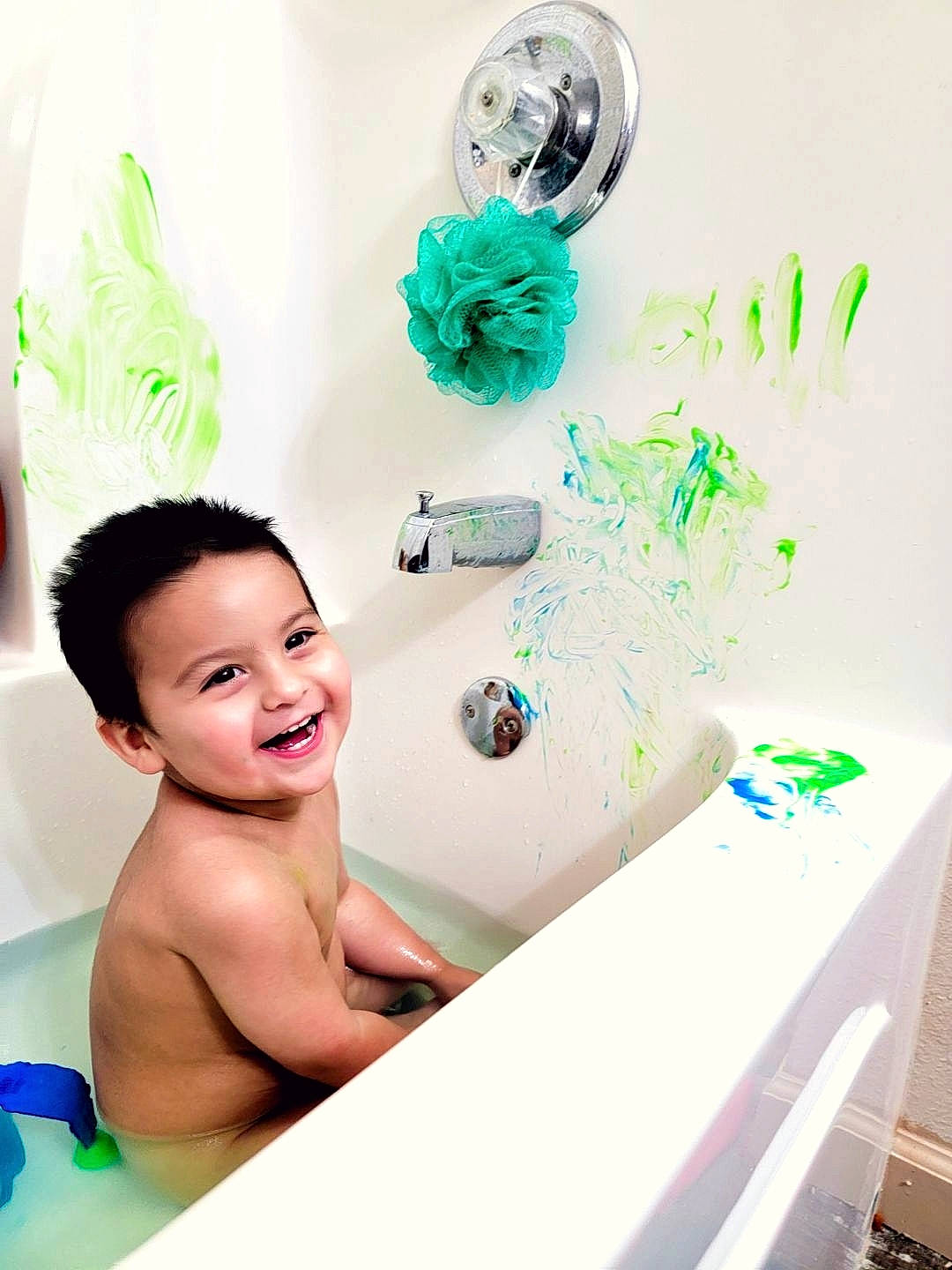 Slade is registered to the contest to win money with this photo: art, baby, bathing, bathroom, child, eyelash, finger, fun, green, happy, illustration, joy, leisure, person, play, plumbing, plumbing_fixture, product, room, smile