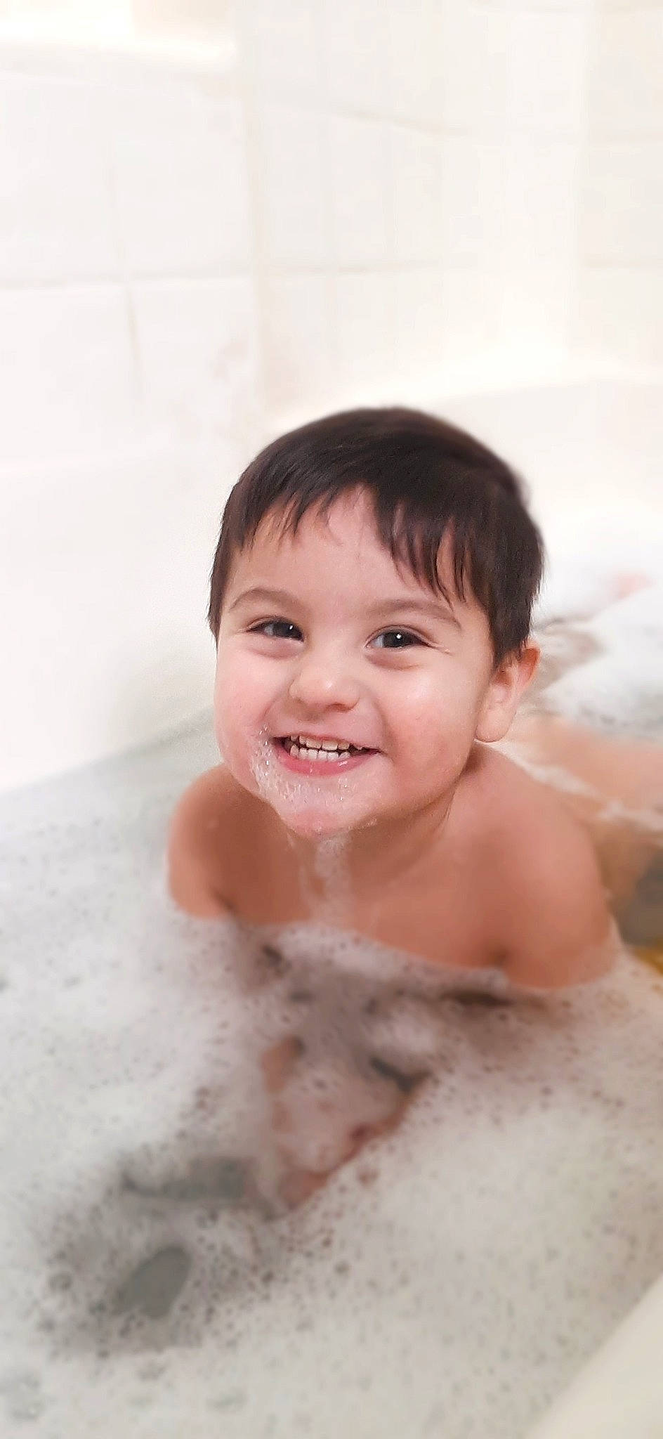 Slade is registered to the contest to win money with this photo: baby, baby_bathing, bathing, bathroom, bathtub, chest, eye, eyebrow, eyelash, fluid, foam, fun, hair, happy, iris, jaw, joy, person, skin, smile
