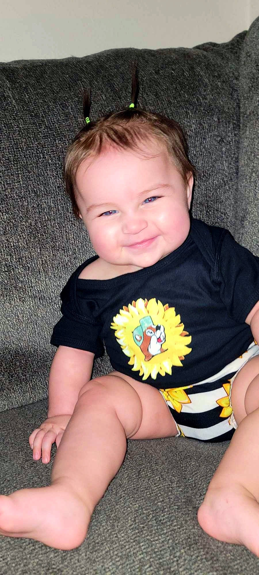 Blair is registered to the contest to win money with this photo: baby_toddler_clothing, black, cheek, eye, face, finger, hair, hairstyle, happy, head, human_body, iris, joy, mouth, neck, organ, person, skin, sleeve, smile