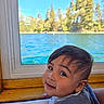 baby, child, infant, smiling, portrait, face, eyes, hair, lake, water, window, windowsill, outdoors, trees, nature, scenery, blue_sky, daylight, clothing, happy
