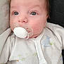 Noé a rejoint le concours — aidez-le/la à gagner de superbes lots ! baby, infant, pacifier, onesie, close_up, portrait, face, eyes, cheek, mouth, skin, hair, newborn, bedding, fabric, button, soft_toys_absent, candid, indoors, cute
