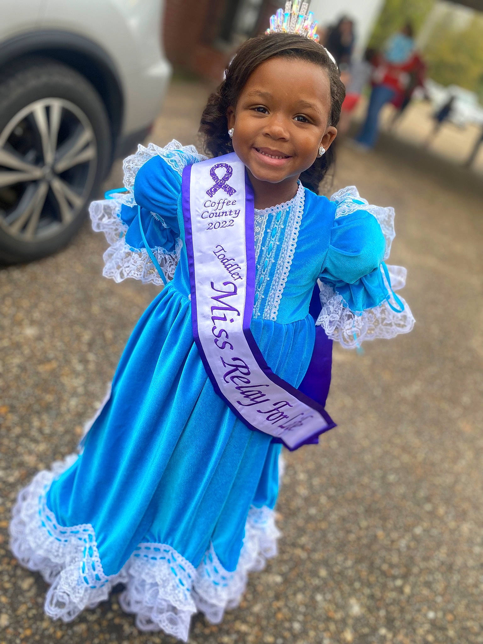 Aubrielle is registered to the contest to win money with this photo: azure, car, child, dance, dress, electric_blue, entertainment, event, face, fun, happy, joy, person, recreation, road, skin, smile, street_fashion, tire, toddler