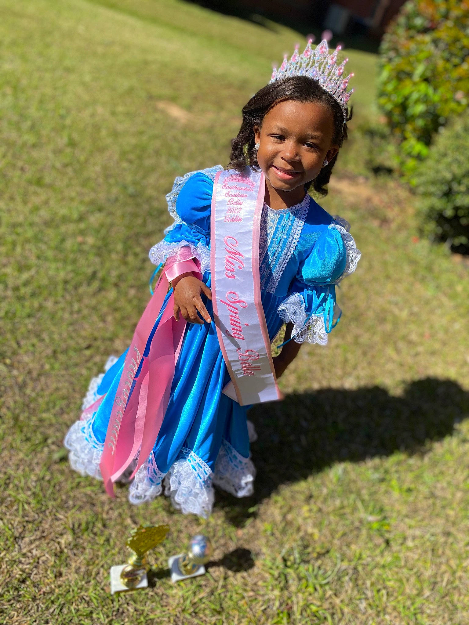 Aubrielle is registered to the contest to win money with this photo: child, dress, electric_blue, event, fun, grass, grass_family, grassland, hair, happy, jewellery, joy, leisure, people_in_nature, person, plant, recreation, sandal, smile, soil