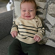 Lucas joined the competition — help win amazing prizes! baby, child, smile, sweater, pants, couch, pillow, indoor, knitwear, happy, face, person, seated, cozy, home, infant, cute, portrait, young, comfort