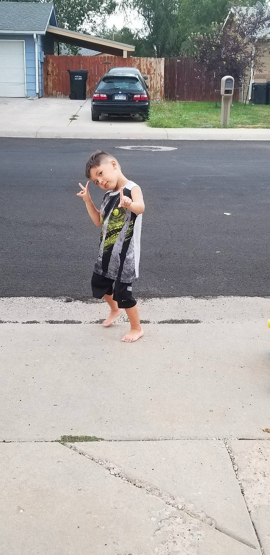 Alejandro joined the competition — help win amazing prizes! asphalt, car, child, day, footwear, fun, infrastructure, jeans, pedestrian, person, play, public_space, recreation, road, shoe, sidewalk, street, tree, trousers, vacation