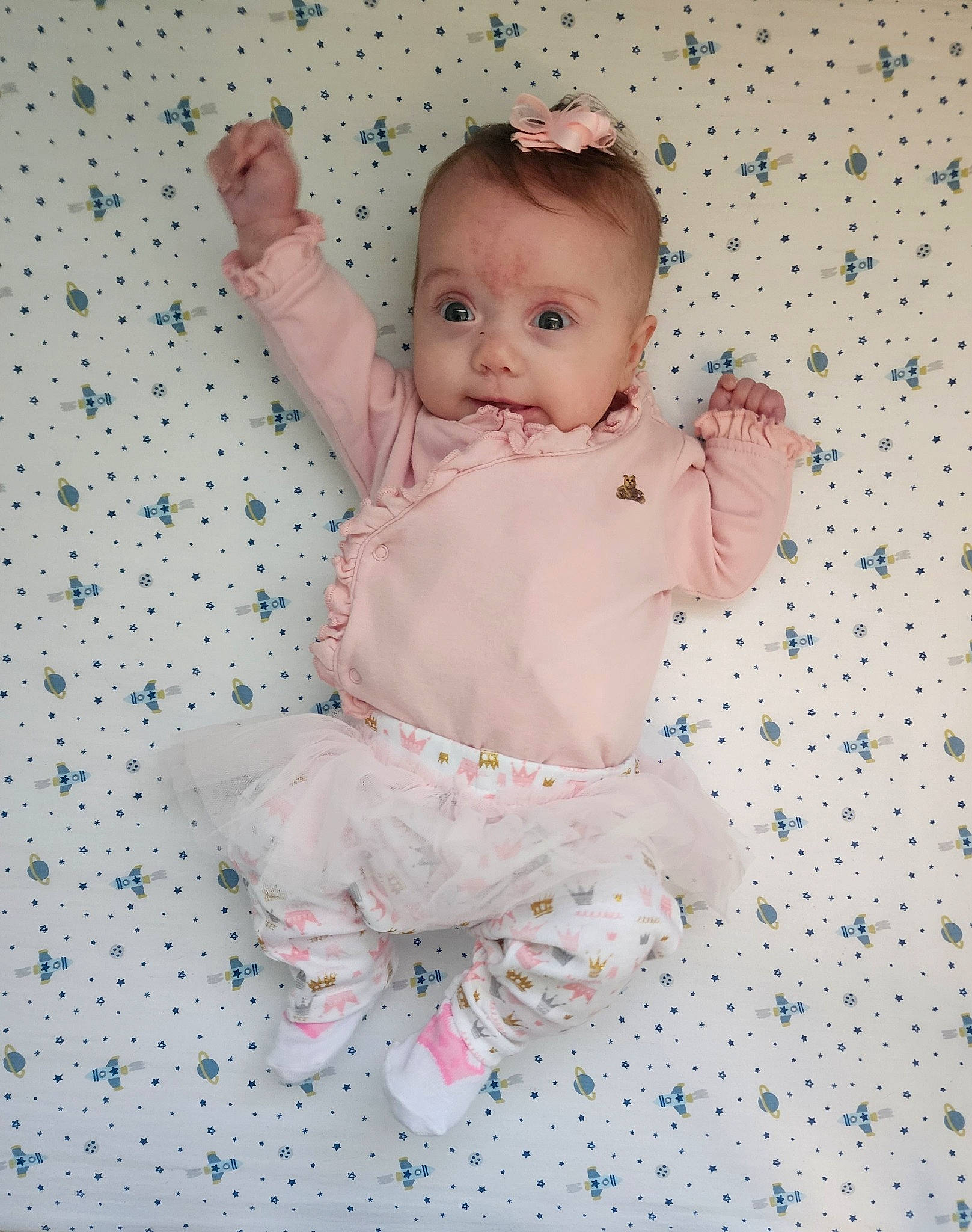 Raylee is registered to the contest to win money with this photo: baby, baby_toddler_clothing, barefoot, cheek, chest, child, face, finger, foot, hand, happy, leg, pattern, person, pink, product, sleeve, stomach, textile, thumb