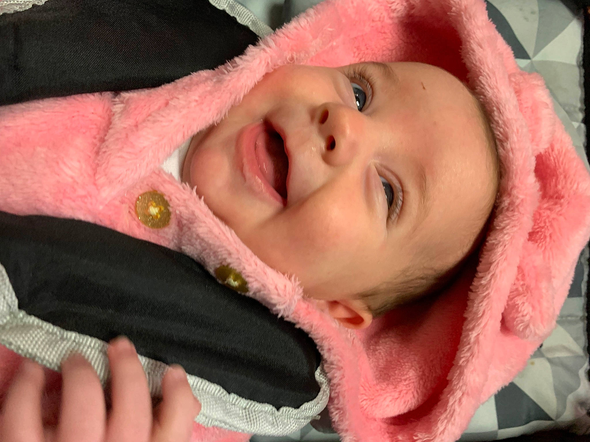 Leona is registered to the contest to win money with this photo: cheek, chin, ear, eyebrow, eyelash, facial_expression, gesture, hand, happy, headwear, iris, jaw, lip, mammal, mouth, neck, nose, person, pink, product