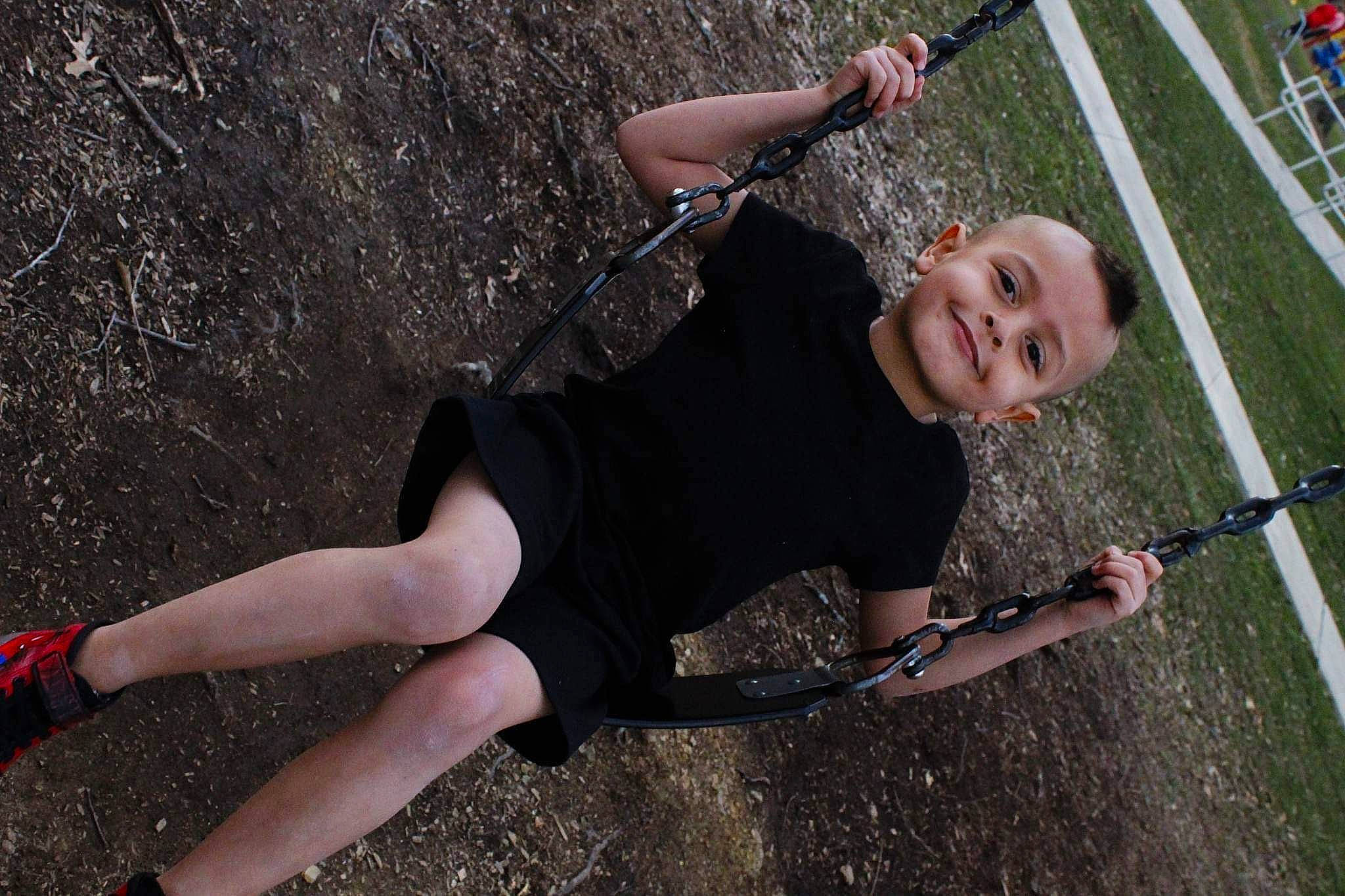 Zamari is registered to the contest to win money with this photo: climbing_harness, competition_event, fun, grass, human_leg, joint, joy, knee, leg, leisure, outdoor_recreation, person, physical_fitness, recreation, rock_climbing_equipment, rope, shorts, smile, sneakers, sports