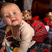 Mclane joined the competition — help win amazing prizes! baby, blanket, blue_eyes, boots, child, couch, crawling, cream_sweater, curious, cute, face, floor, indoors, infant, person, plaid_dress, portrait, smiling, soft_lighting, toy