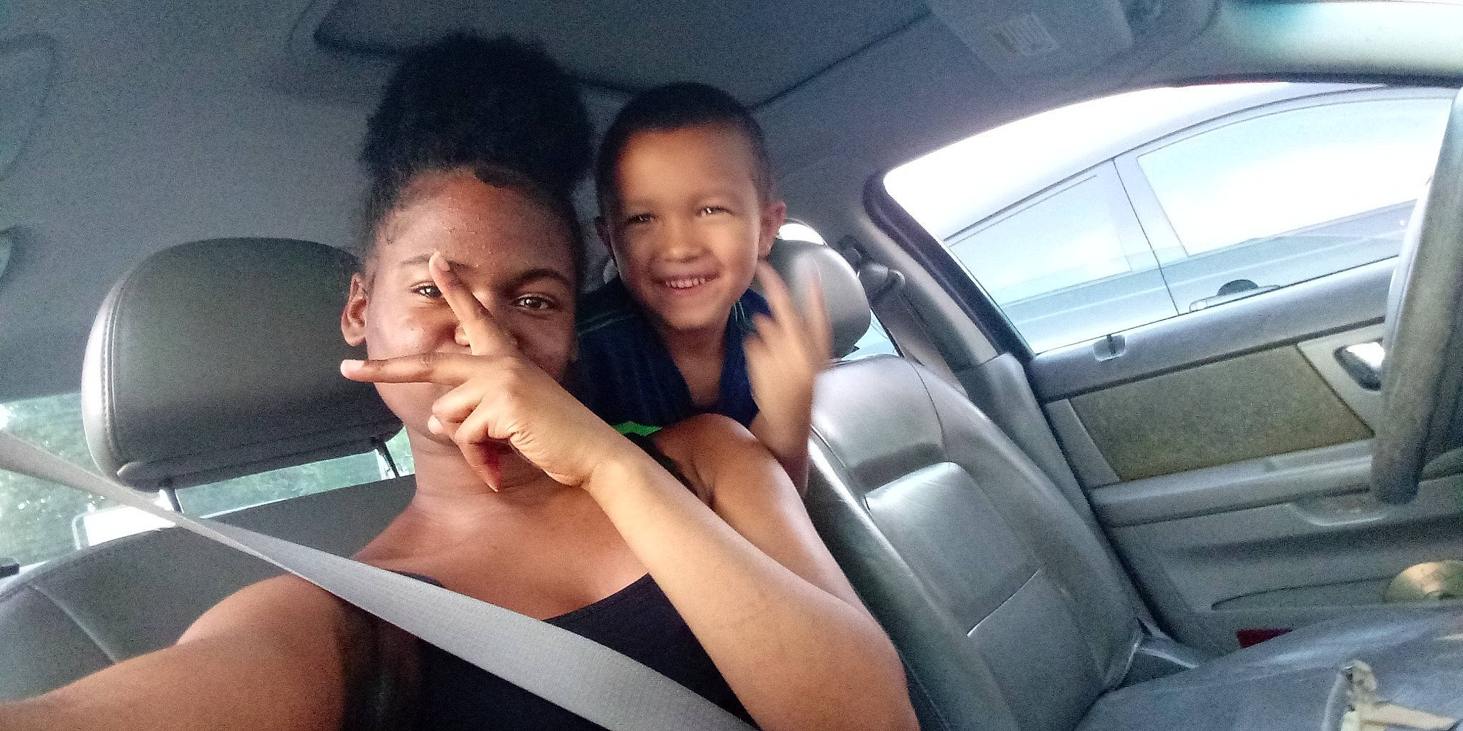 Jakyle King is registered to the contest to win money with this photo: auto_part, automotive_window_part, car, car_seat, driving, family_car, joy, luxury_vehicle, mid_size_car, person, photography, seat_belt, smile, vacation, vehicle, vehicle_door