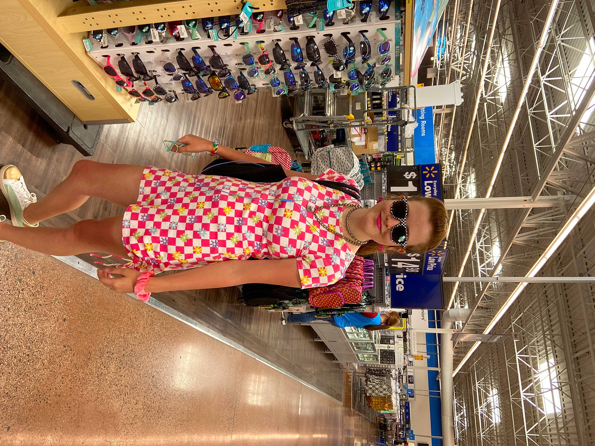 Ayla is registered to the contest to win money with this photo: building, city, electric_blue, engineering, eyewear, fun, human_leg, joy, leisure, machine, pattern, pedestrian, person, recreation, retail, shopping, smile, sunglasses, t_shirt, thigh