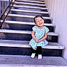 casual, child, concrete, cute, daylight, dress, fashion, girl, happy, joyful, outdoor, person, portrait, railing, sitting, smile, socks, stairs, wall, young