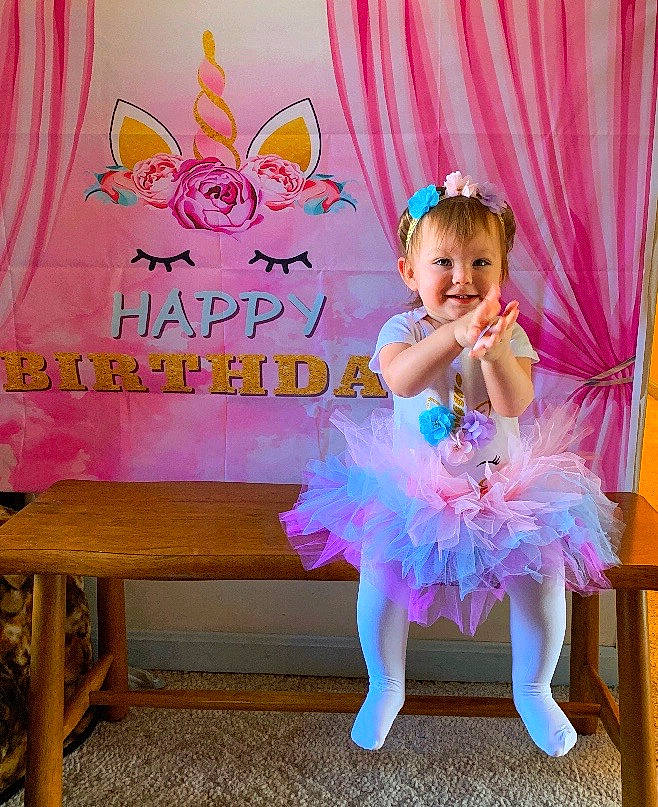 Lilyann is registered to the contest to win money with this photo: ballet, ballet_dancer, ballet_tutu, birthday, child, clothing, costume, dance, joy, party, person, pink, room, shoe, table, toddler