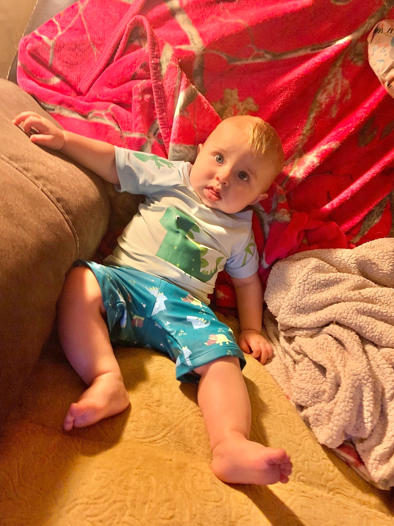 Cullen is registered to the contest to win money with this photo: baby, baby_toddler_clothing, barefoot, child, comfort, finger, flooring, foot, fun, human_leg, joint, lap, leg, mouth, person, pink, skin, textile, thigh, toddler