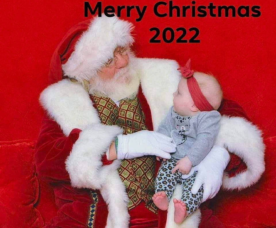 Rowan is registered to the contest to win money with this photo: beard, carmine, christmas, christmas_eve, costume_hat, event, facial_hair, fictional_character, fur, fur_clothing, happy, hat, holiday, human_body, lap, person, santa_claus, sitting, sleeve, tail