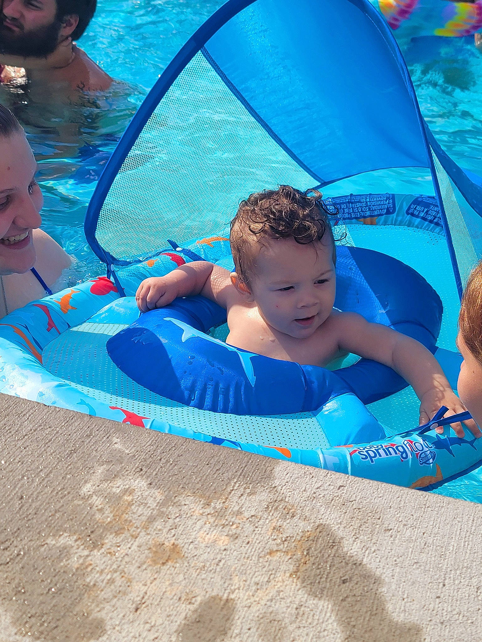 Davion is registered to the contest to win money with this photo: aqua, azure, baby, baby_float, baby_products, bathing, blue, child, comfort, electric_blue, fun, games, happy, leisure, person, personal_protective_equipment, recreation, summer, swimming_pool, toddler