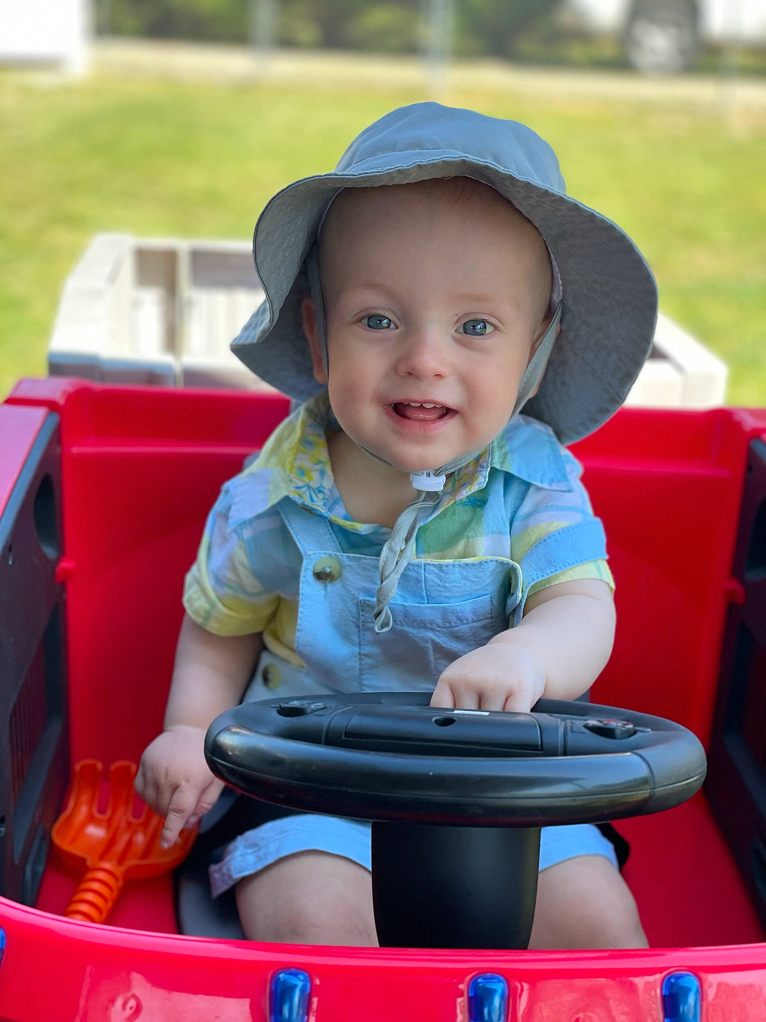 Liam is registered to the contest to win money with this photo: baby, baby_toddler_clothing, cap, child, face, fun, grass, happy, hat, leisure, person, photograph, product, recreation, skin, smile, summer, sun_hat, toddler, travel