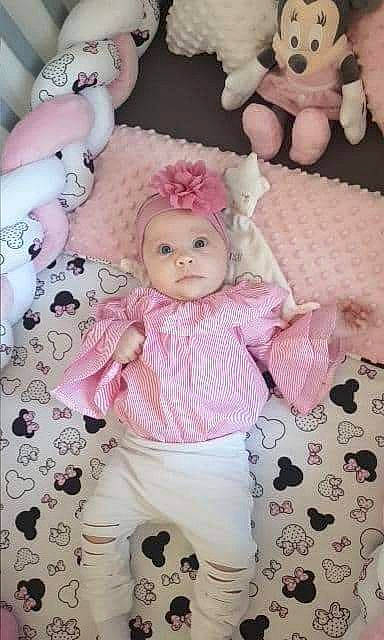 Shaïly participe au concours pour gagner de l'argent avec cette photo : art, baby_toddler_clothing, cheek, child, design, doll, dress, eyelash, fawn, headwear, magenta, pattern, peach, person, pink, product, room, sleeve, textile, toy