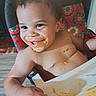 arm, baby, child, colorful, cute, face, food, hand, happy, high_chair, indoor, kitchen, meal_time, messy, pattern, seat, shirtless, smiling, spaghetti, toddler