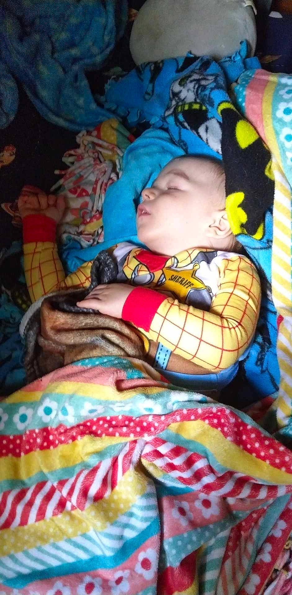 Nicklas is registered to the contest to win money with this photo: baby, baby_carriage, baby_products, baby_toddler_clothing, bedtime, blanket, child, comfort, fun, head, linens, magenta, nap, pattern, person, sitting, sleep, textile, toddler