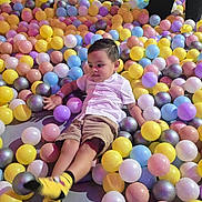 Jesus joined the competition — help win amazing prizes! ball_pit, child, family, fun, happy, indoor_play, legs, multicolored_balls, party, pastel, playground, portrait, recreation, shorts, smile, socks, toddler, toys, white_shirt, yellow_socks