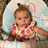 Rane joined the competition — help win amazing prizes! baby, infant, child, baby_seat, colorful_clothing, fruit_pattern, winnie_the_pooh, rainbow, toy_bar, striped_toy, indoor, carpet, cute, portrait, face, eyes, hair, arm, expression, comfort