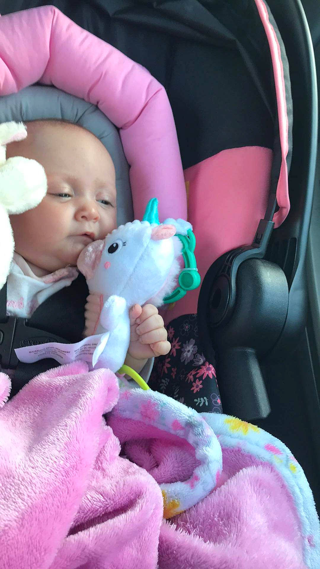 Freyja joined the competition — help win amazing prizes! baby, baby_carriage, baby_in_car_seat, baby_products, baby_toddler_clothing, car_seat, cheek, comfort, finger, hand, mouth, nail, person, photograph, pink, product, seat_belt, skin, textile, toddler