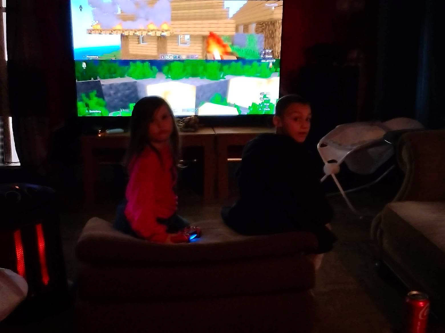 Destiny is registered to the contest to win money with this photo: audio_equipment, comfort, couch, display_device, electronic_device, entertainment, event, flat_panel_display, flooring, fun, gadget, house, houseplant, leisure, living_room, multimedia, person, room, surprise, technology