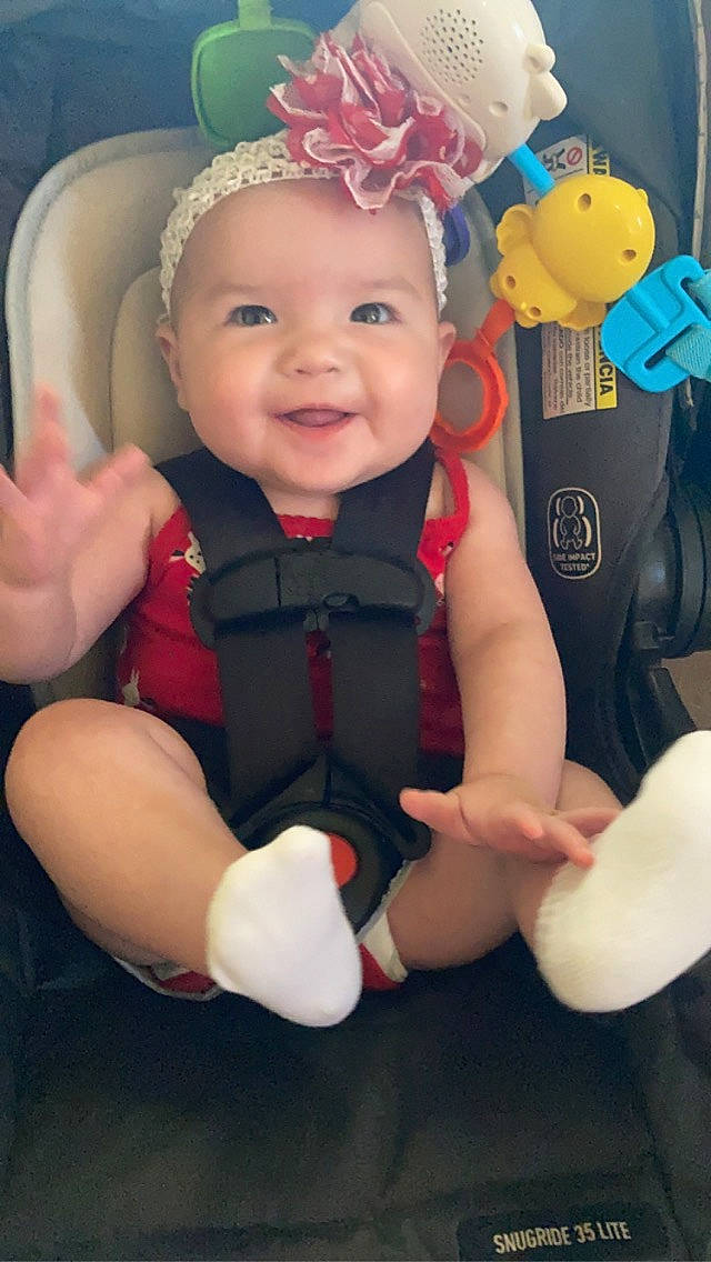 Alaïa is registered to the contest to win money with this photo: baby, baby_products, baby_toddler_clothing, child, finger, fun, gesture, happy, head, headgear, headwear, joy, mammal, nail, party_supply, person, pink, skin, smile, thumb