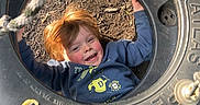 Levi joined the competition — help win amazing prizes! child, tire_swing, playground, smiling, red_hair, rope, outdoor, wood_chips, blue_sweater, yellow_pants, happy, play, fun, person, recreation, childhood, leisure, casual_clothing, daylight, ground
