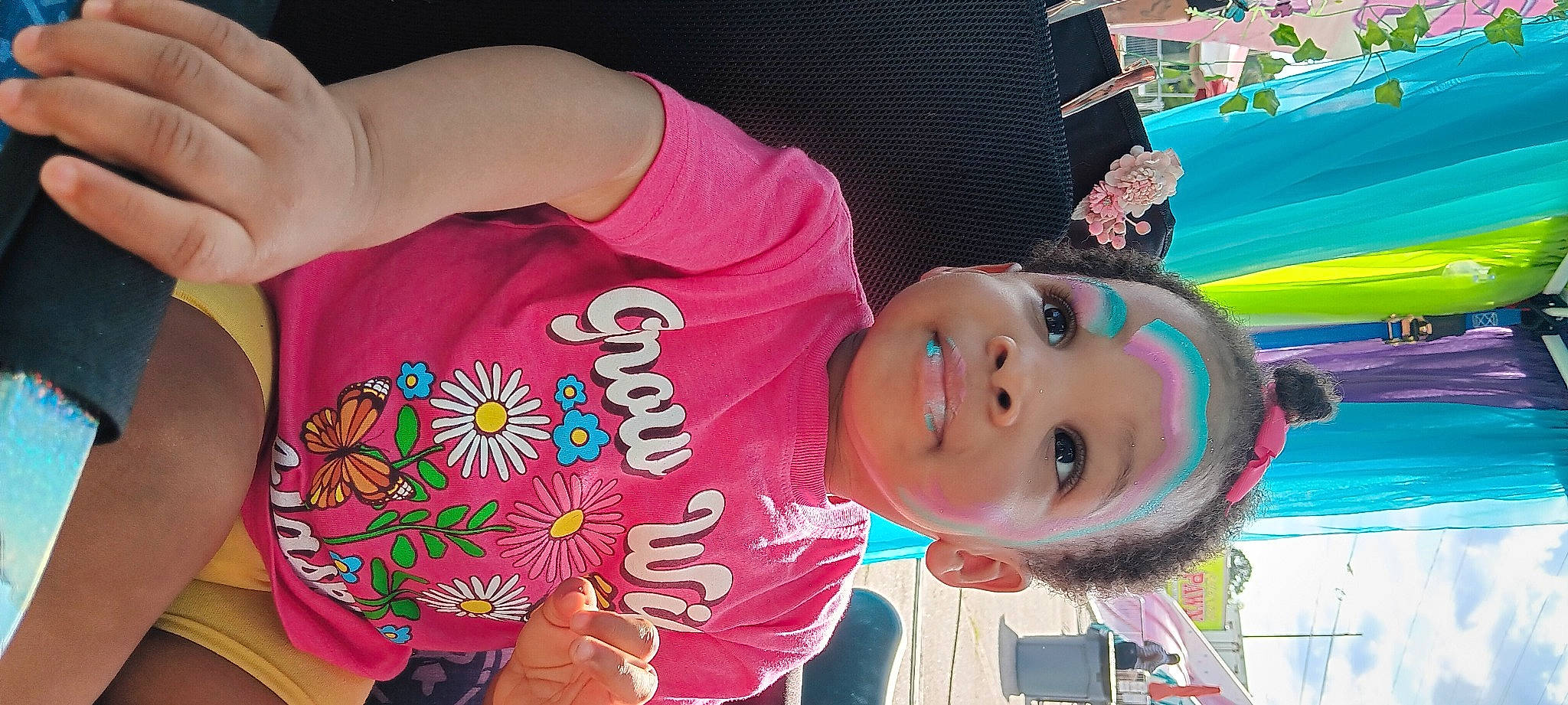 Ella is registered to the contest to win money with this photo: child, city, cool, elbow, fun, green, happy, joy, leisure, magenta, neck, pattern, person, pink, play, recreation, smile, t_shirt, toddler, tree