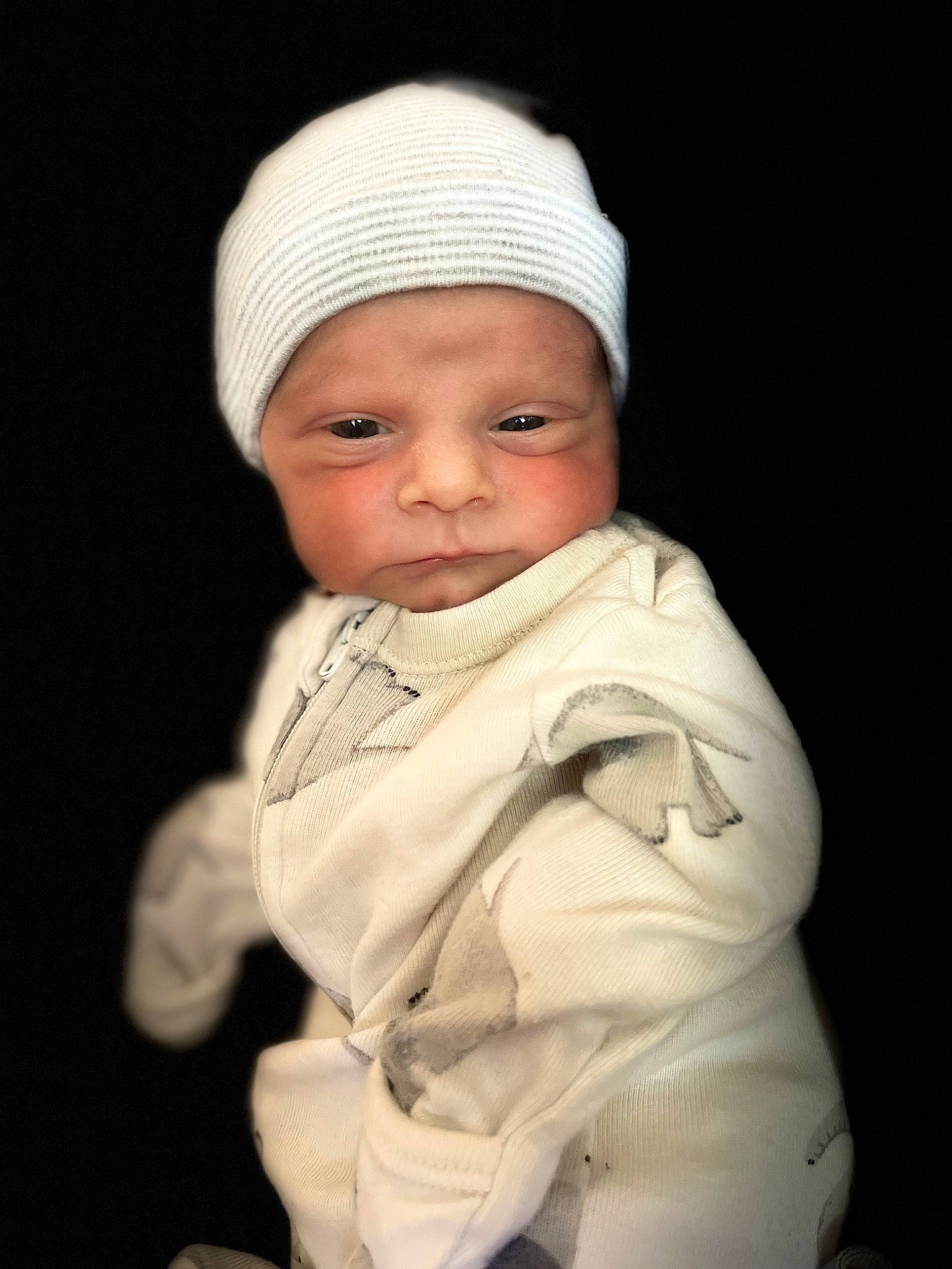 River Lee is registered to the contest to win money with this photo: baby, cap, cheek, chin, comfort, eye, eyebrow, face, flash_photography, head, headgear, headwear, human_body, jacket, lip, nose, outerwear, person, skin, sleeve