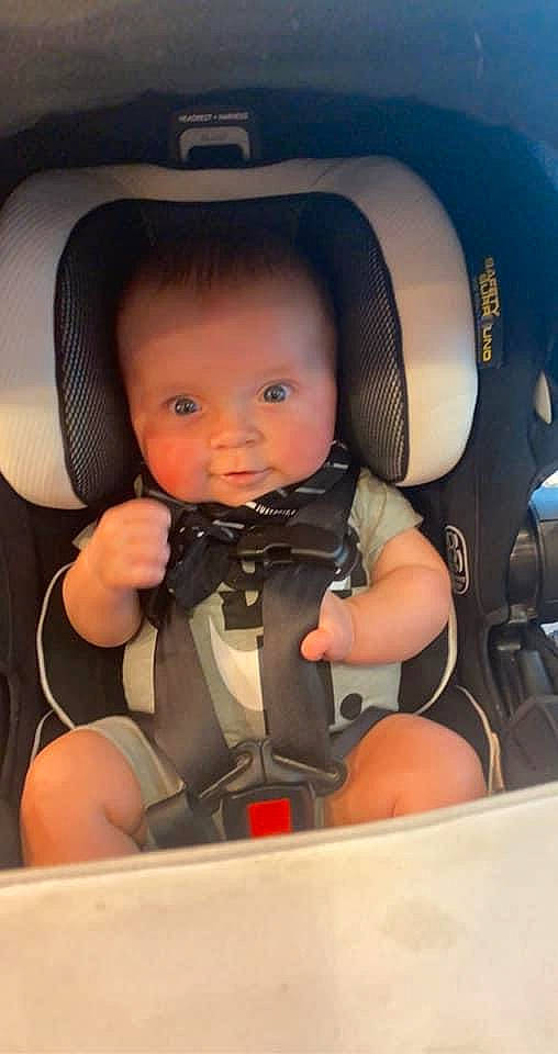 Romen is registered to the contest to win money with this photo: auto_part, automotive_design, automotive_exterior, baby, baby_carriage, baby_in_car_seat, baby_safety, car, car_seat, car_seat_cover, comfort, head_restraint, motor_vehicle, person, personal_luxury_car, plant, seat_belt, steering_wheel, thigh, toddler