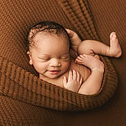 Michael joined the competition — help win amazing prizes! newborn, baby, sleeping, blanket, brown, knitted, cozy, infant, cute, smile, curled_up, peaceful, skin, hand, foot, portrait, closeup, resting, wrapped, soft