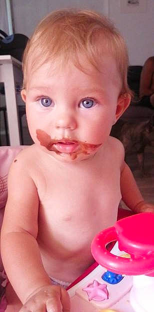 élia participe au concours pour gagner de l'argent avec cette photo : baby, cheek, chest, chin, dress, drinkware, ear, eyelash, finger, fun, iris, jaw, lip, mouth, neck, nose, person, pink, skin, table