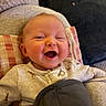Adelyn joined the competition — help win amazing prizes! baby, smiling, happy, infant, face, clothing, blanket, cushion, cute, indoors, cozy, child, portrait, warm, soft, comfort, giraffe_pattern, head, person, laughing
