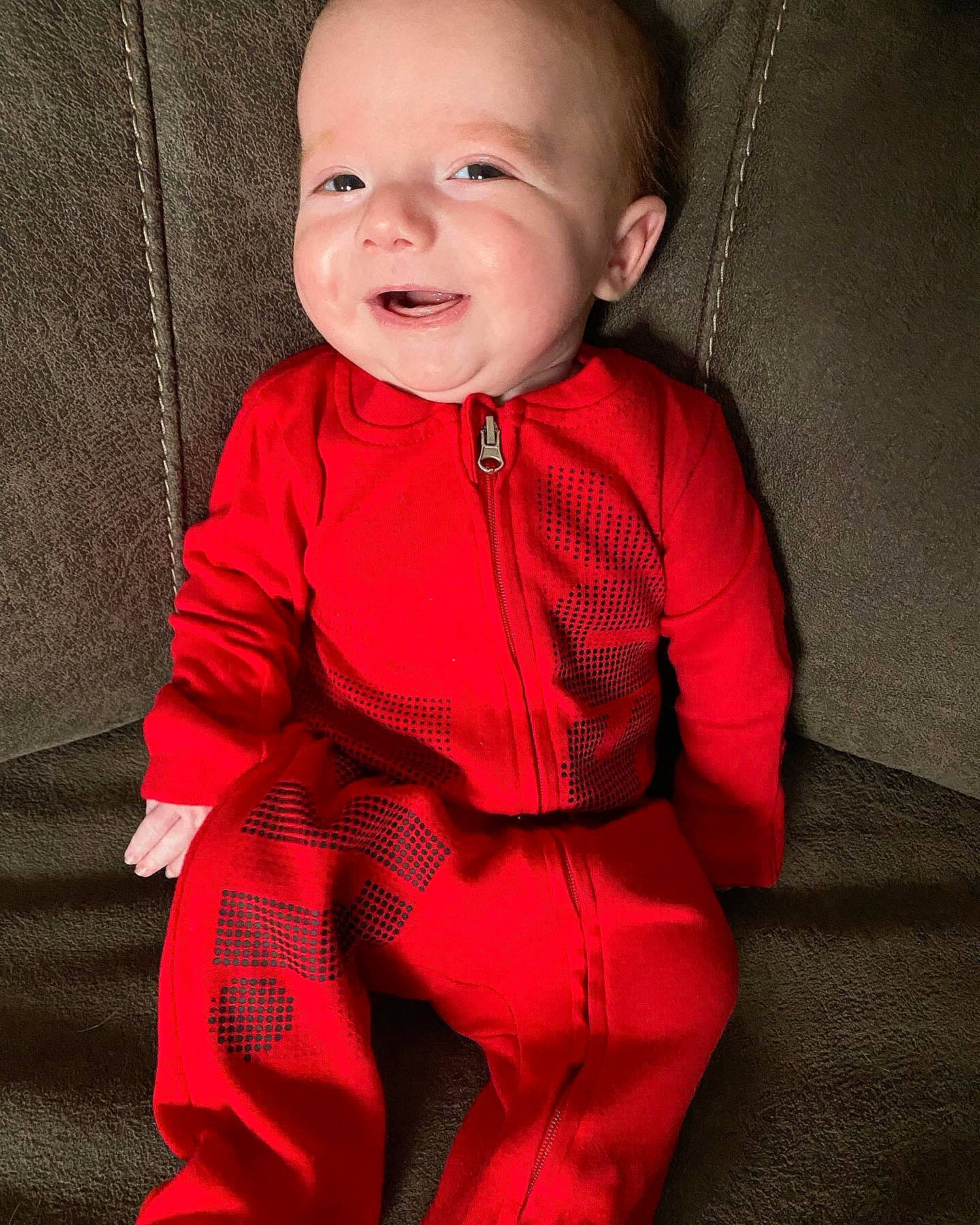 Eli is registered to the contest to win money with this photo: baby, baby_toddler_clothing, blazer, cheek, chin, collar, face, head, iris, lip, magenta, neck, outerwear, pattern, person, pink, skin, sleeve, smile, textile