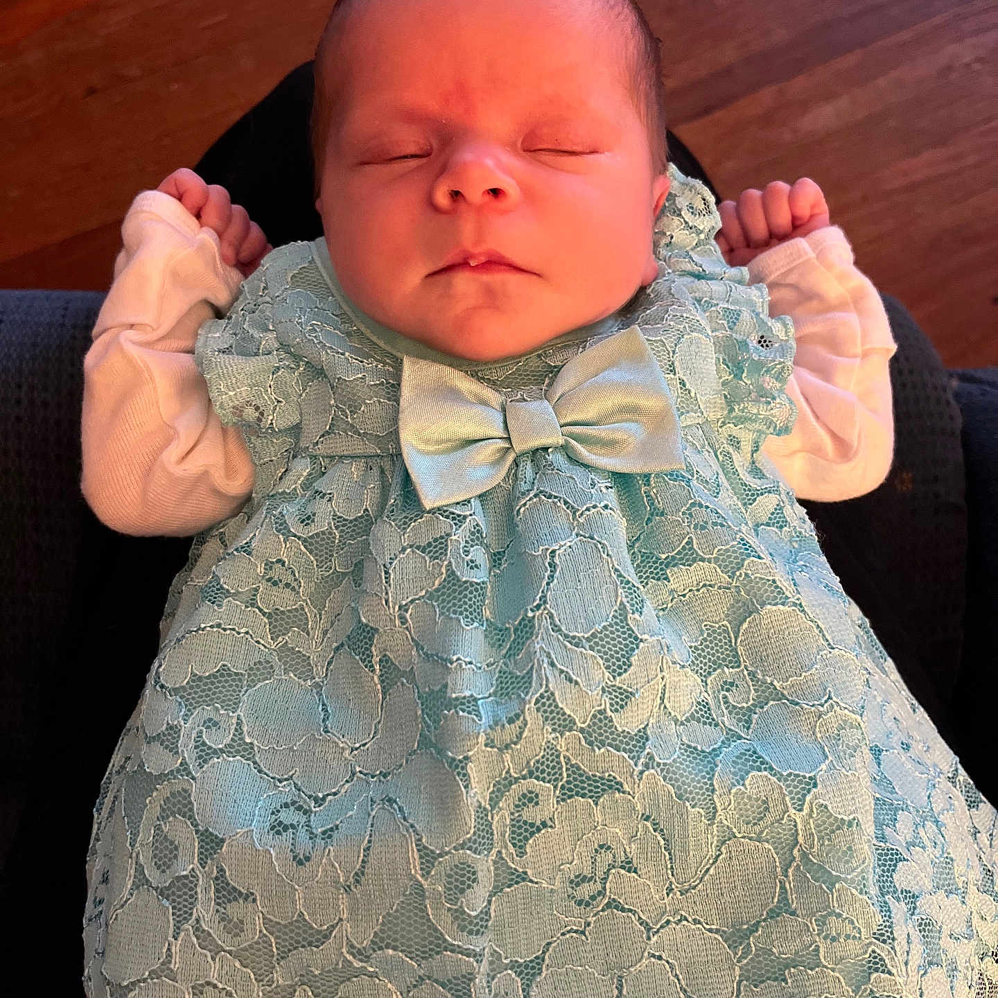 Allison joined the competition — help win amazing prizes! baby, newborn, sleeping, dress, lace, bow, infant, clothing, portrait, peaceful, resting, hands, cute, indoors, wood_floor, person, soft_light, closeup, tiny, adorable